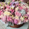 A large basket of pink and white flowers