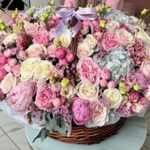 A large basket of pink and white flowers