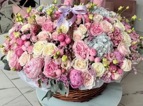 A large basket of pink and white flowers