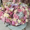 A large basket of pink and white flowers