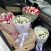 A vibrant bunch of flowers arranged in a car seat, adding a touch of color and beauty to the vehicle's interior.