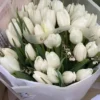 A vibrant bunch of flowers arranged in a car seat, adding a touch of color and beauty to the vehicle's interior.